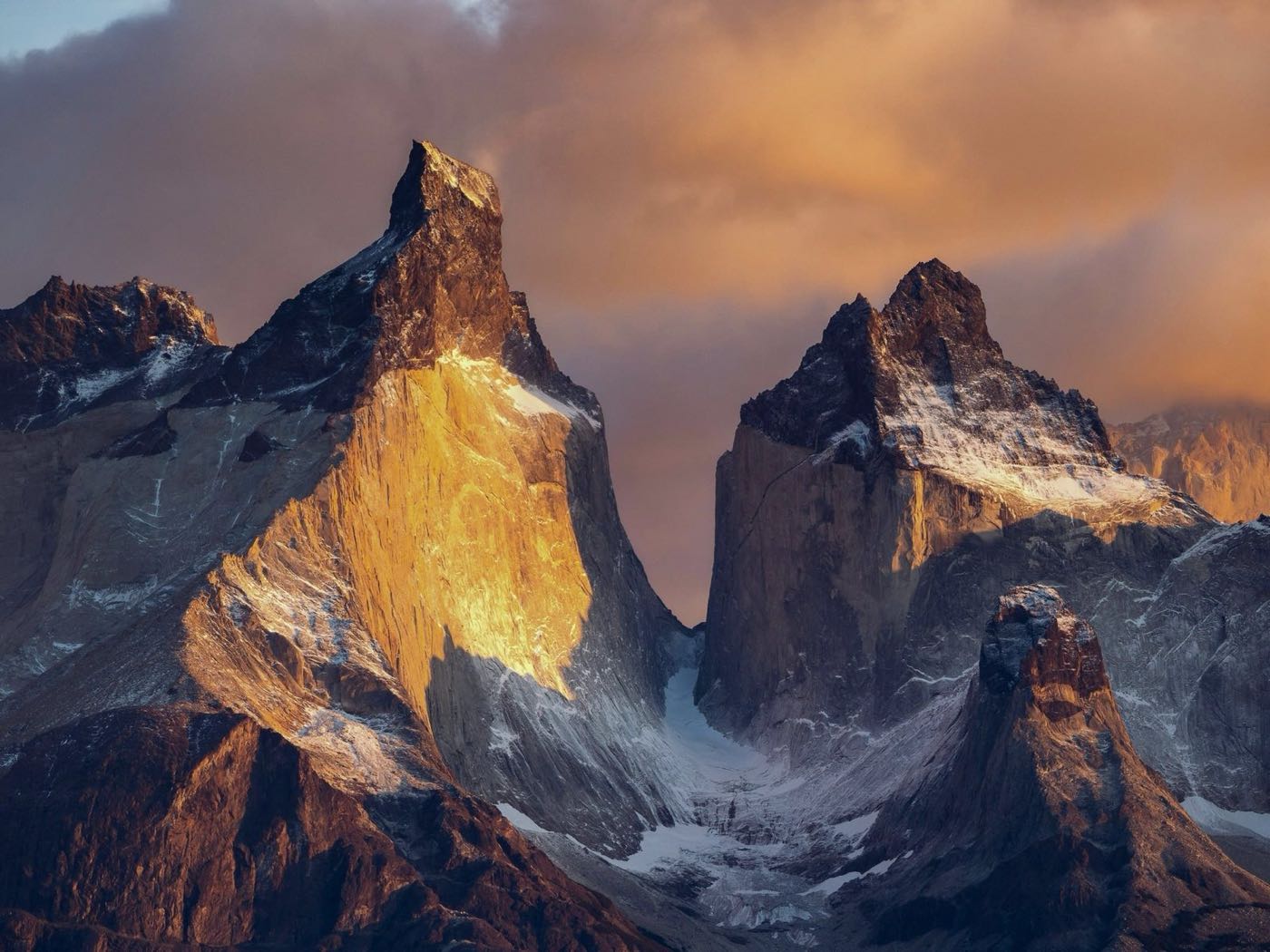 The granite peaks of Torres del Paine lit gold at sunset