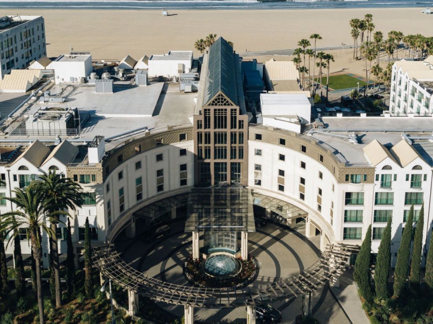 Aerial view of Regent Santa Monica Beach with the sand and ocean beyond